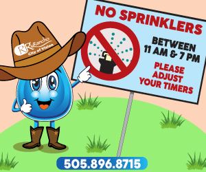 water droplet pointing to a sign that indicates no sprinklers between 11am-7pm