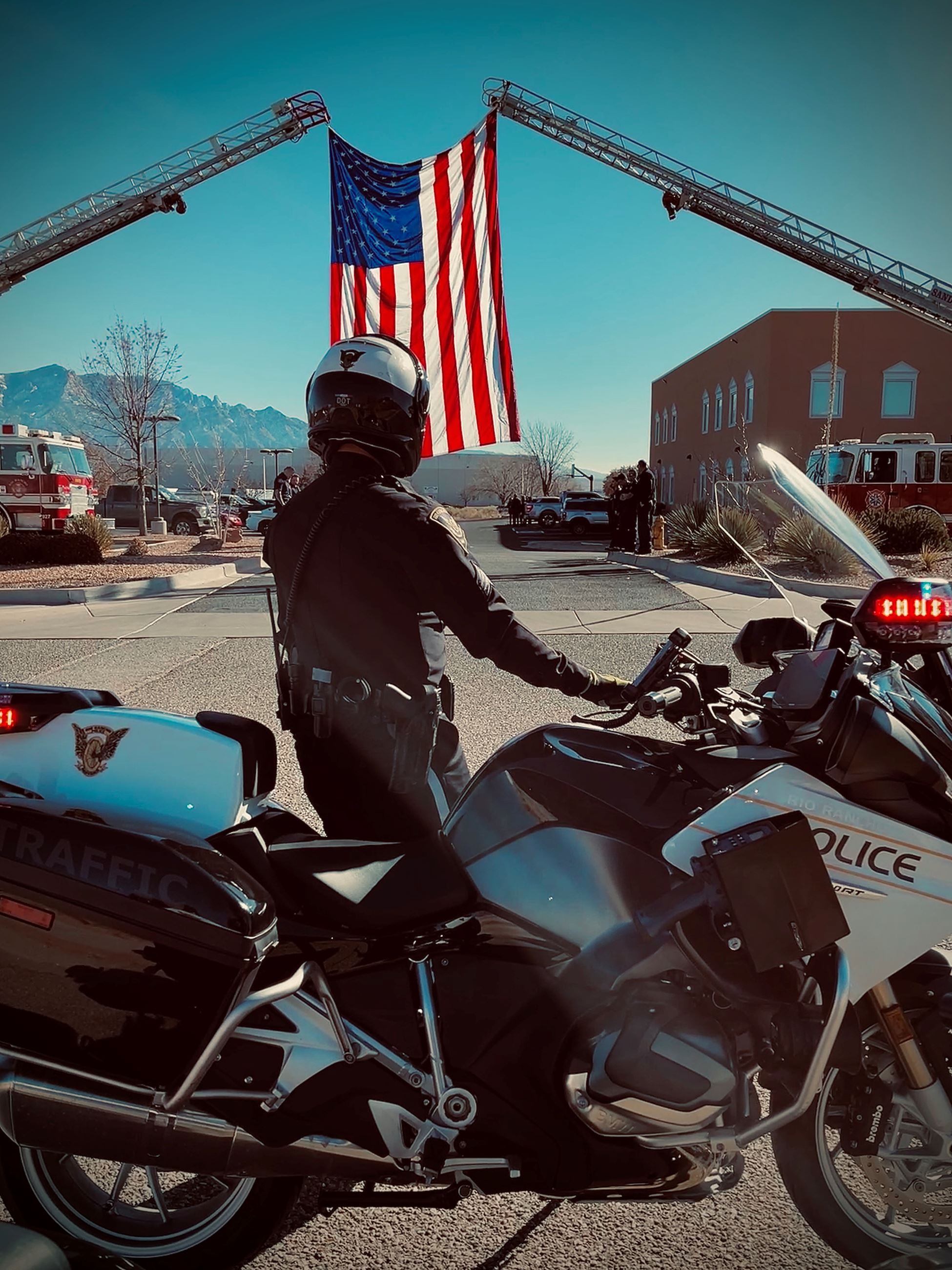 Police officer on motorcycle with American flag